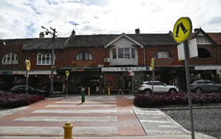 A building with a crosswalk and a street sign

AI-generated content may be incorrect.
